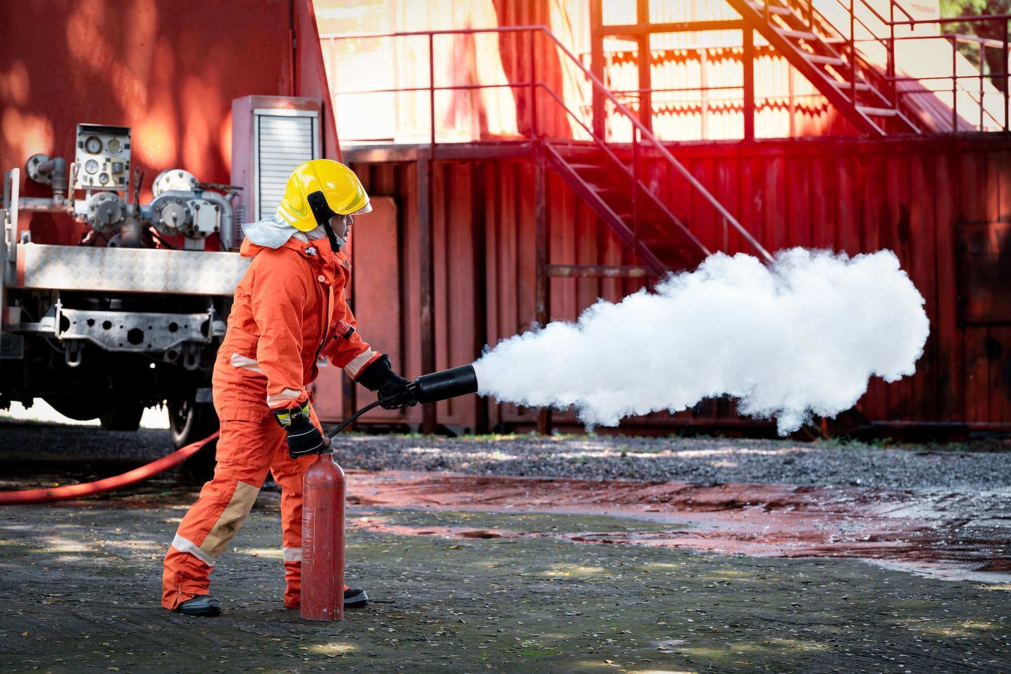 Fireman with fire extinguisher